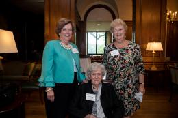 Three guests gather at President's Reception