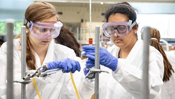 Two NDMU students working in the lab