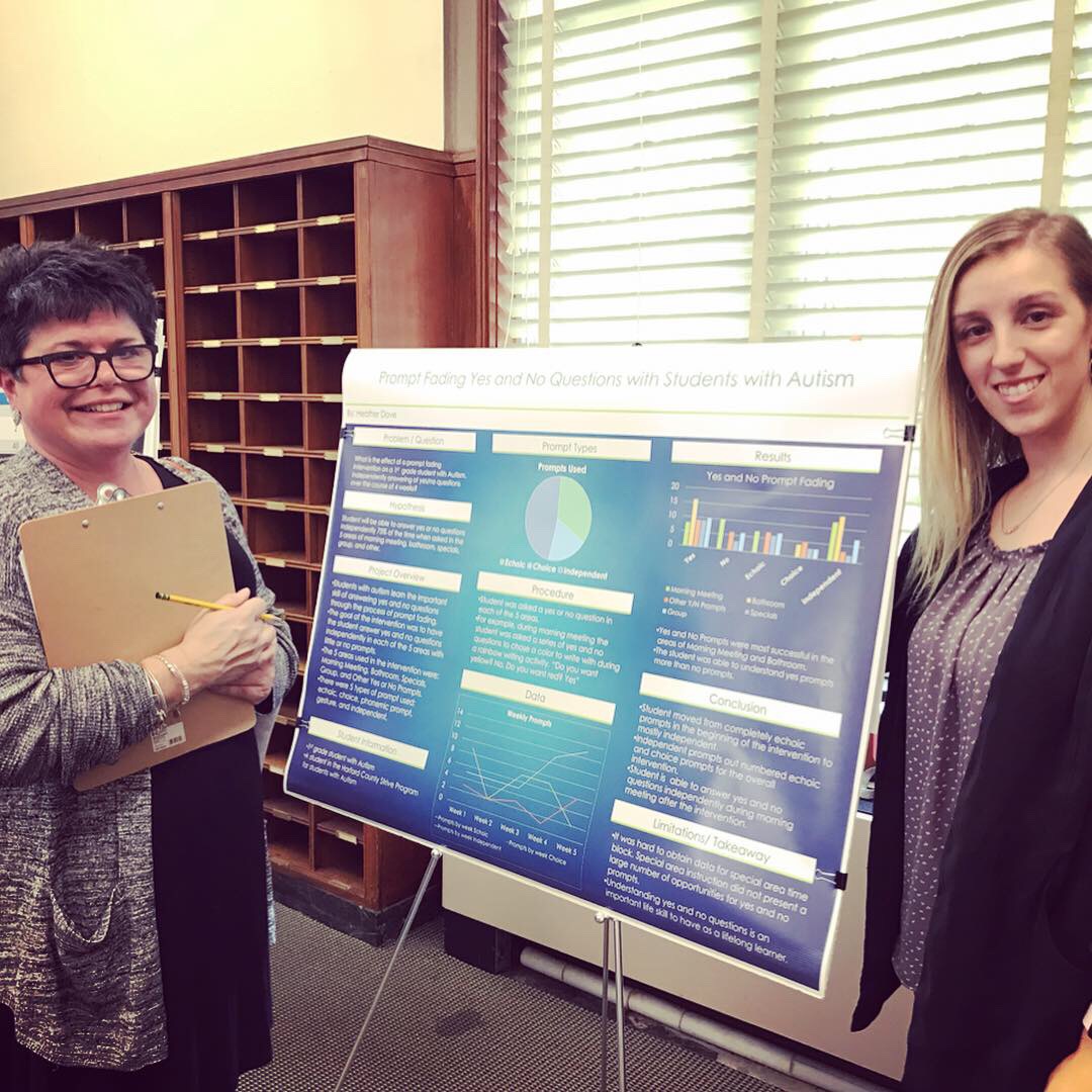 Research day student poses with speaker