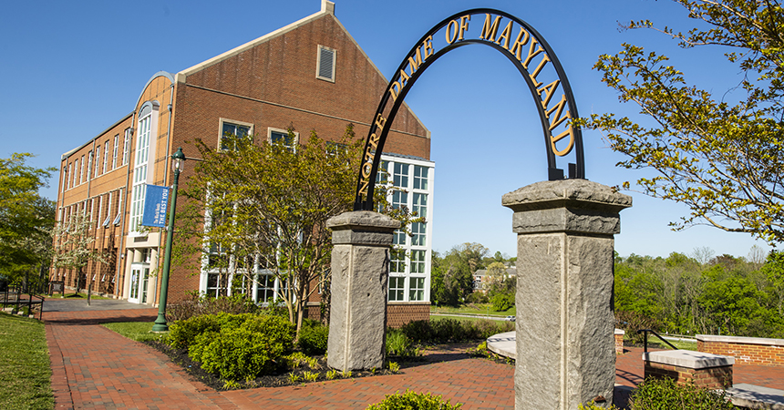NDMU's Archway, with the University Academic Building in the background
