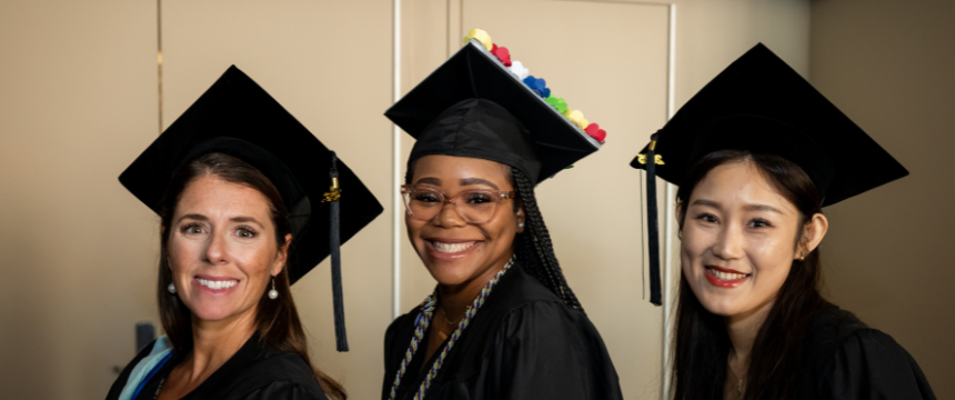 3 female students at Commencement