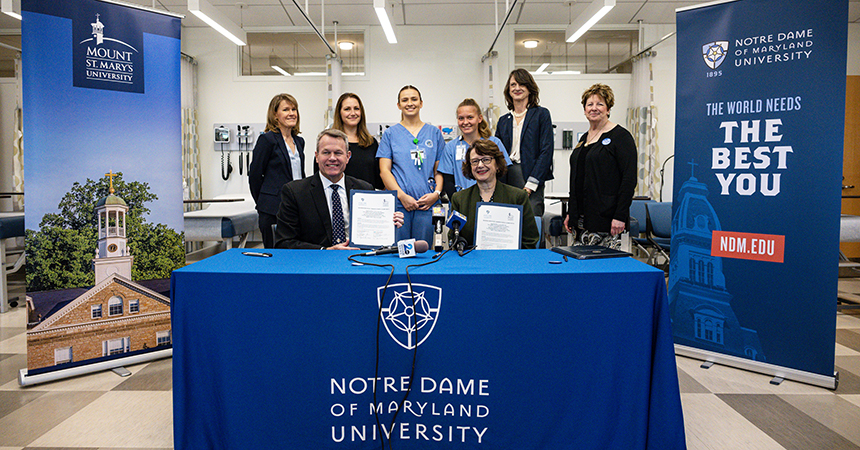 NDMU and Mount St. Mary's representatives celebrate their joint agreement signing