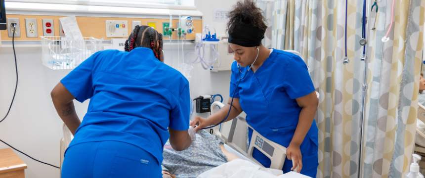 Nursing student working on a patient