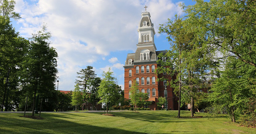An outdoor photo of campus featuring Caroline Hall