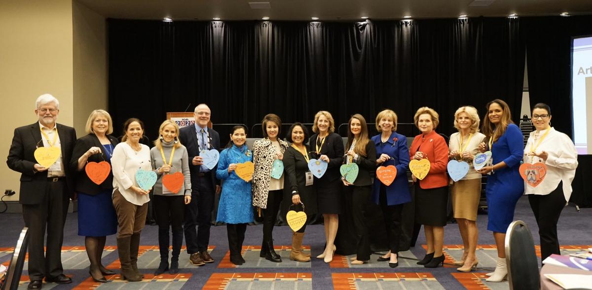 group of people at National Governors Association show off their art projects