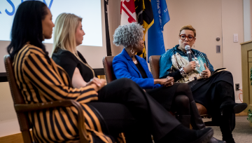 Panel of women discussing business topics