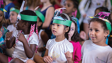 Kids wearing construction paper head pieces