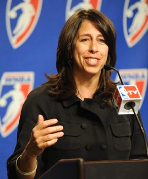 Donna Orender speaking into a microphone