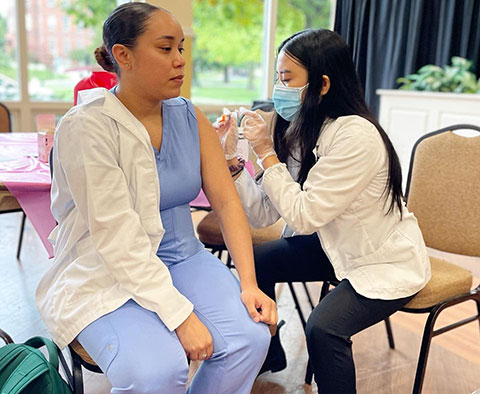 pharmacy student working on a patients