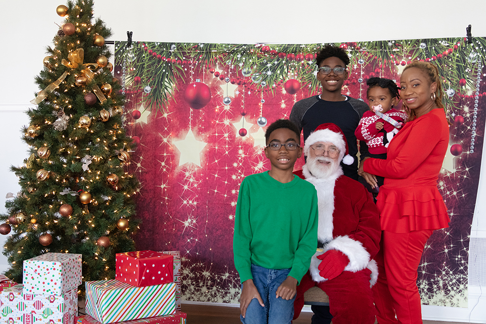 Group photo with Santa at previous Holiday Breakfast