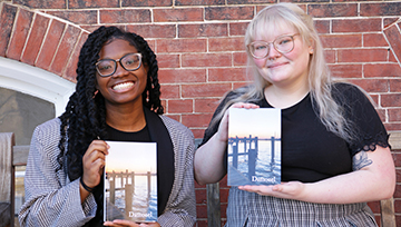 Rochelle Thompson and Lindsey Pytrykow pose with copies of Damozel