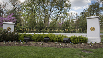 An NDMU sign on Charles Street