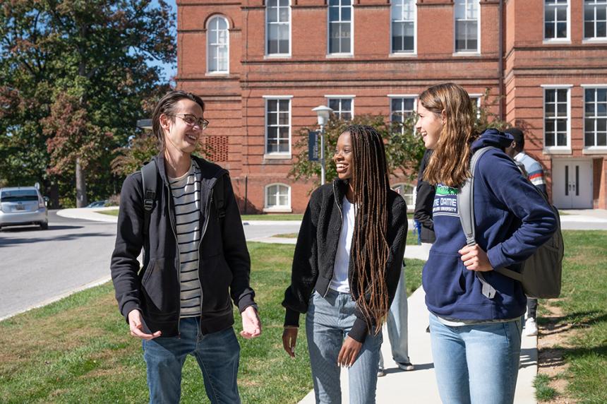 students walking in front of caroline hall