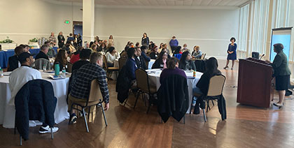 people have meeting in a large room