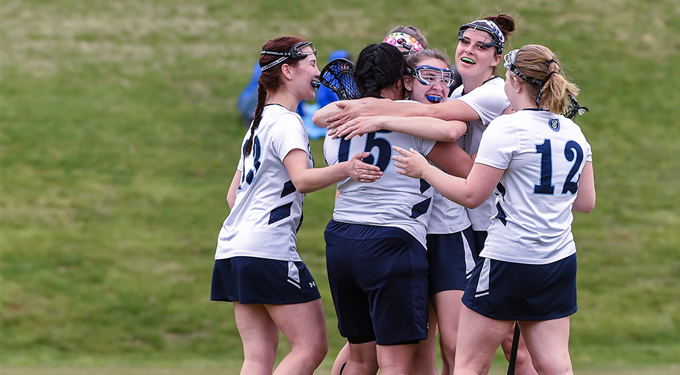 Lacrosse players hugging as a group