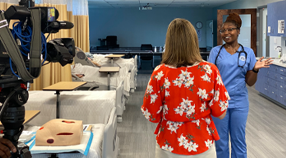 News interviewing an ABSN student in the nursing lab