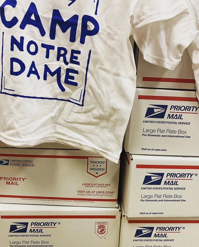 camp notre dame t-shirt and packed boxes