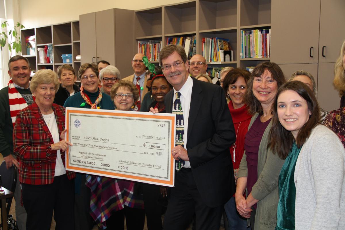 sister sharon presented with check