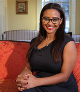 Woman with glasses seated