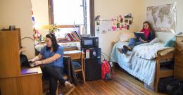 students sitting in dorm room