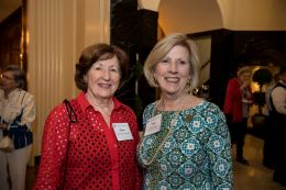 Two guests smile at President's Reception