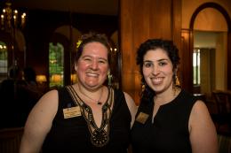 Two women smiles at event