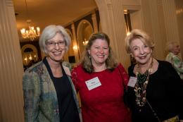 Two alumnae smile with an SSND