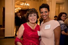 Two women pose for the camera