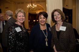 Three guests smile for the camera