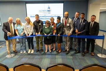 NDMU and community members cutting the ribbon in Knott