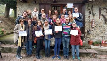 a group of students holding scholarship certificate