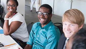 Students sitting at a table for orientation