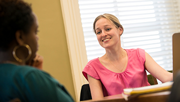 Adult student speaking with a counselor
