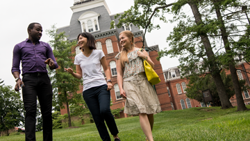 three eli students walking around campus