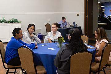 students and alums at a networking event