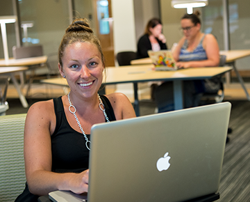 Woman sitting at a laptop