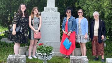 The Heritage Tour group at Mother Caroline's grave in Milwaukee