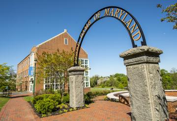 NDMU's Archway, with the University Academic Building in the background