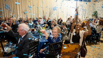 People throwing confetti in celebration