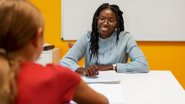 A teacher and student in a classroom