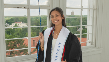 Sarah Generoso posing in graduation garb