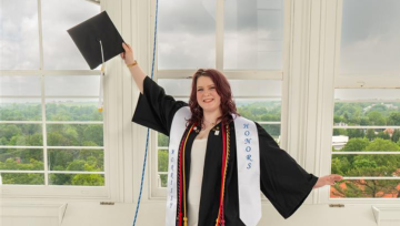 Rebecca Becraft posing in cap and gown