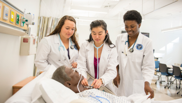 Nursing students with sim man