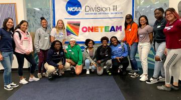 a group of people in front of NCAA and one team logo