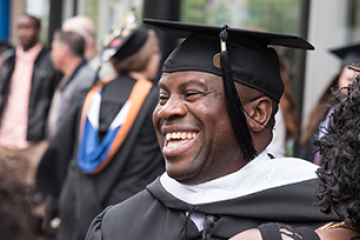 Male Adult Undergraduate Studies Graduate in cap and gown