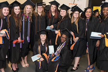 Group photo of graduates in cap and gowns