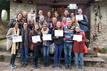 a group of students holding scholarship certificate