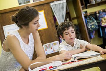 Teacher helping student 