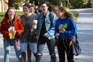 group of students walking across campus