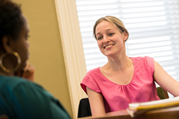 Adult student speaking with a counselor